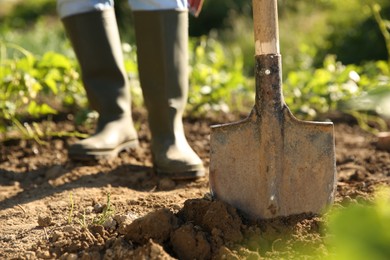 Photo of Farmer with shovel on sunny day, closeup