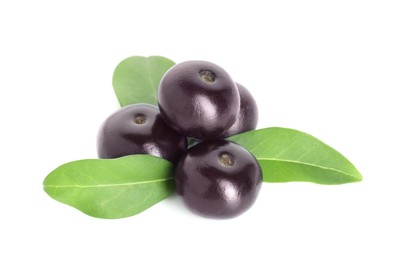 Photo of Fresh ripe acai berries and green leaves isolated on white