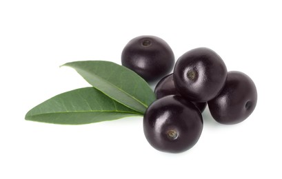 Photo of Fresh ripe acai berries and green leaves isolated on white