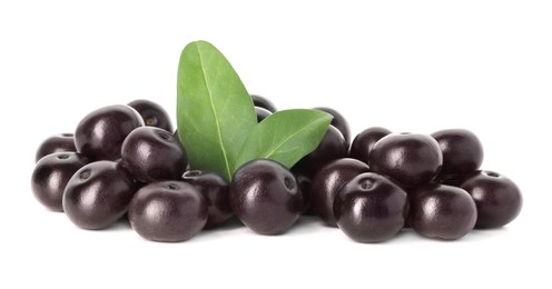 Photo of Fresh ripe acai berries and green leaves isolated on white