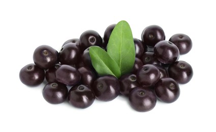 Photo of Fresh ripe acai berries and green leaves isolated on white