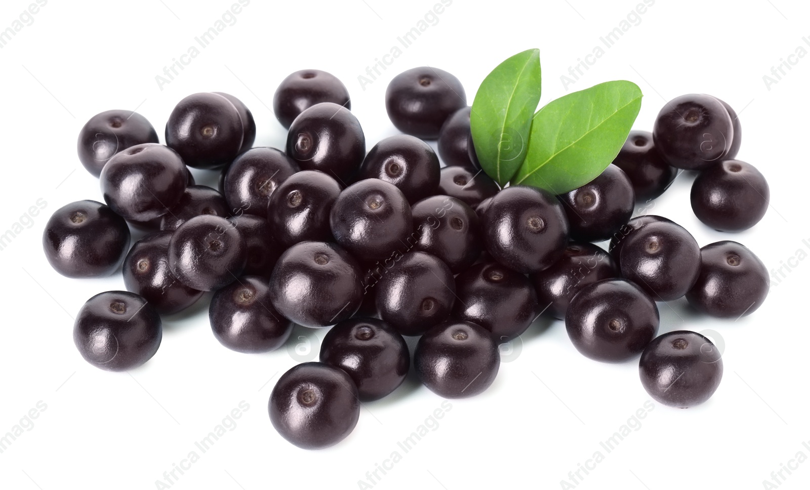 Photo of Fresh ripe acai berries and green leaves isolated on white