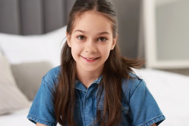 Portrait of beautiful little girl indoors. Cute child