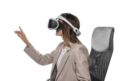 Smiling woman using virtual reality headset while sitting in office chair on white background