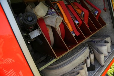 Photo of View of fire engine equipment inside modern fire truck