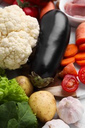 Cooking tasty stew. Different fresh vegetables on table, closeup