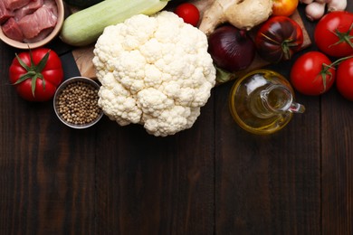 Photo of Different ingredients for stew on wooden table, top view. Space for text