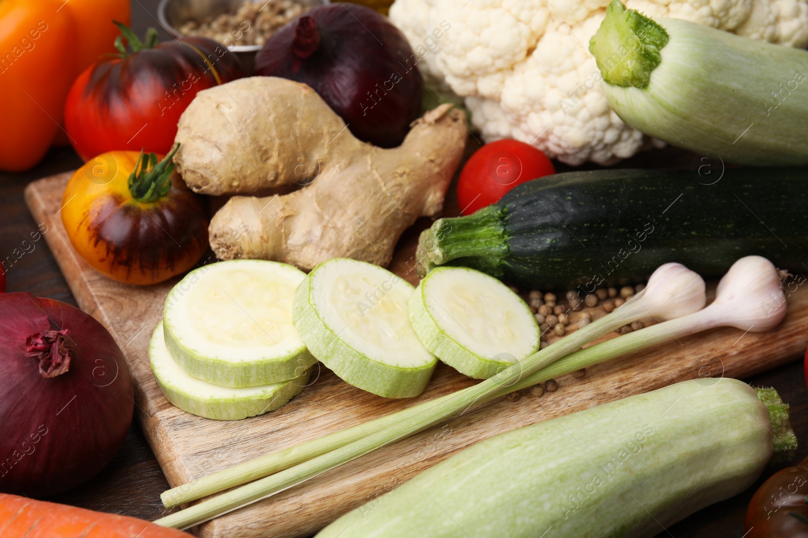 Photo of Cooking tasty stew. Fresh vegetables on table