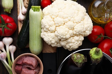 Different ingredients for stew on table, top view