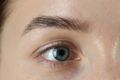 Woman with beautiful blue eyes, macro photo