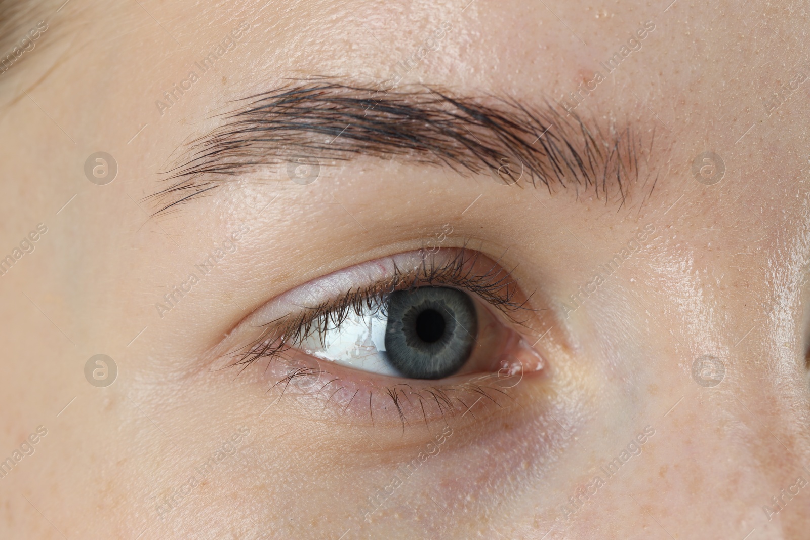 Photo of Woman with beautiful blue eyes, macro photo