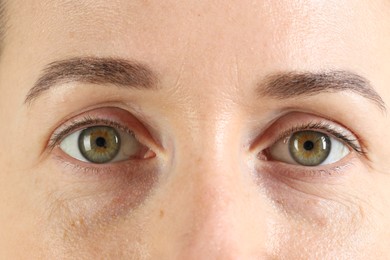 Woman with beautiful green eyes, closeup view