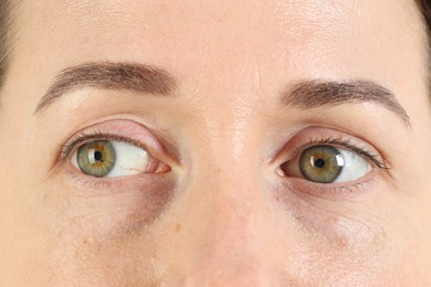 Woman with beautiful green eyes, closeup view