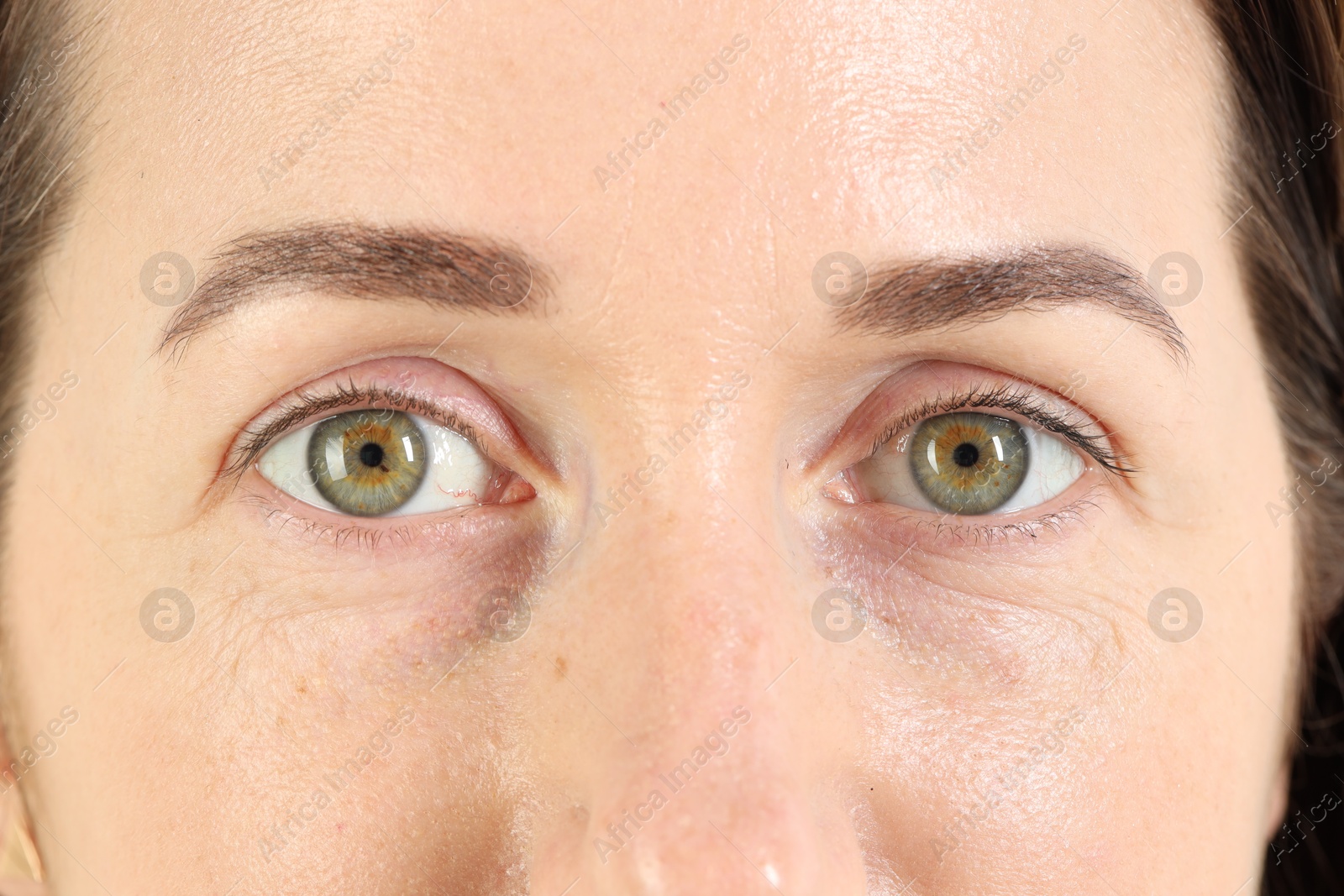 Photo of Woman with beautiful green eyes, closeup view