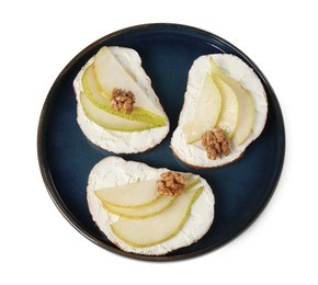 Delicious bruschettas with ricotta cheese, pears and walnuts isolated on white, top view