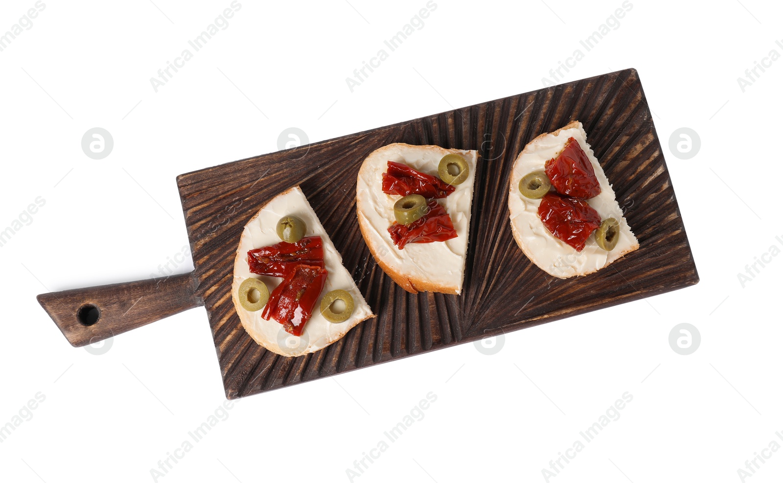 Photo of Delicious bruschettas with ricotta cheese, sun dried tomatoes and olives isolated on white, top view