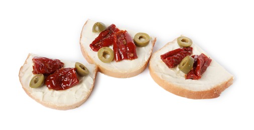 Photo of Delicious bruschettas with ricotta cheese, sun dried tomatoes and olives isolated on white