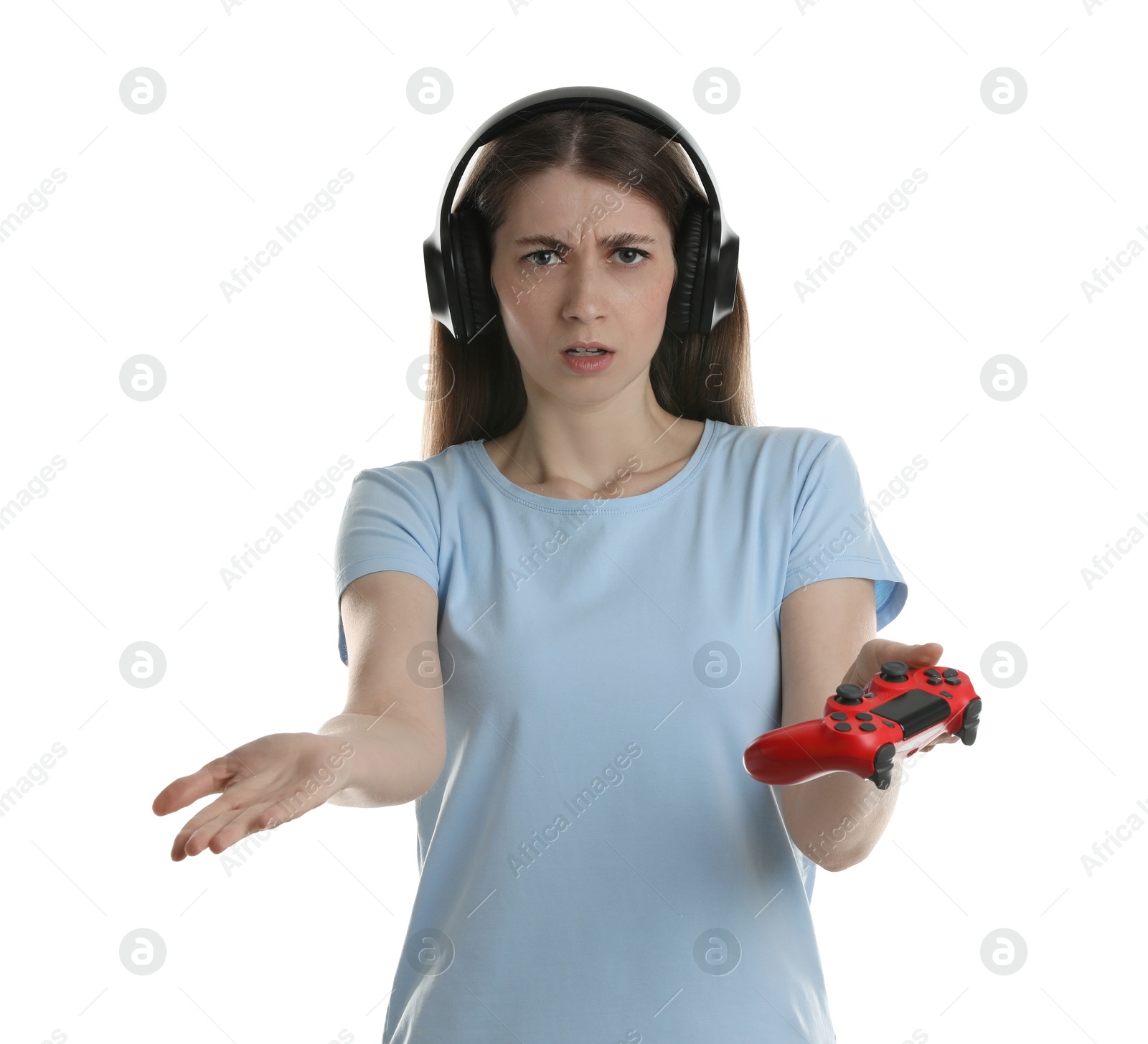 Photo of Disappointed woman in headphones with controller on white background