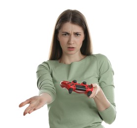 Unhappy woman with controller on white background