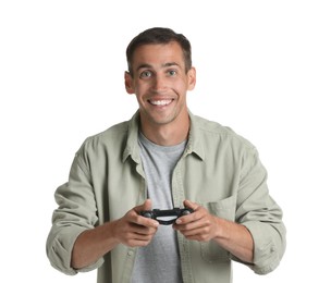 Happy man playing video games with controller on white background