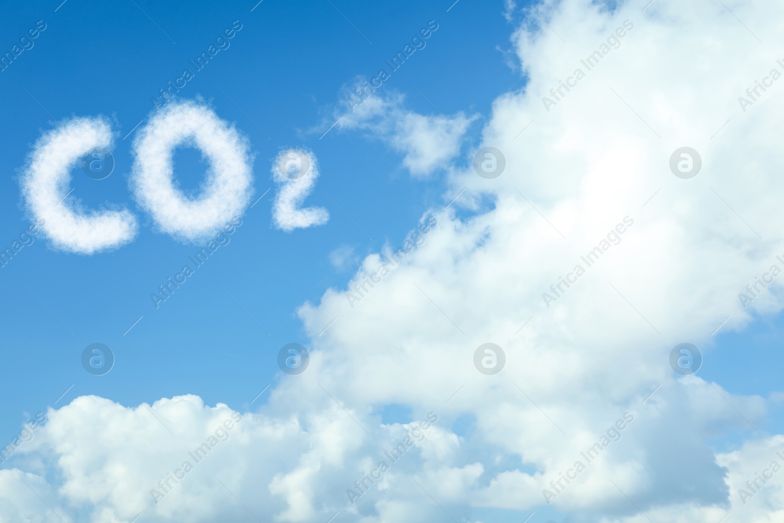 Image of Blue sky with CO2 chemical formula and clouds. Carbon dioxide emissions