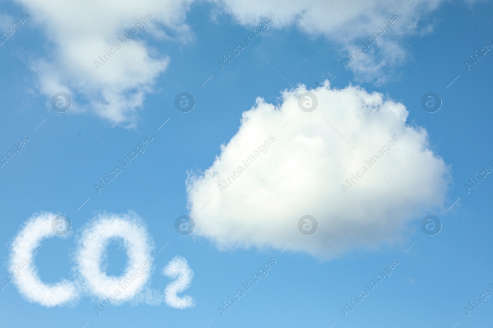 Image of Blue sky with CO2 chemical formula and clouds. Carbon dioxide emissions