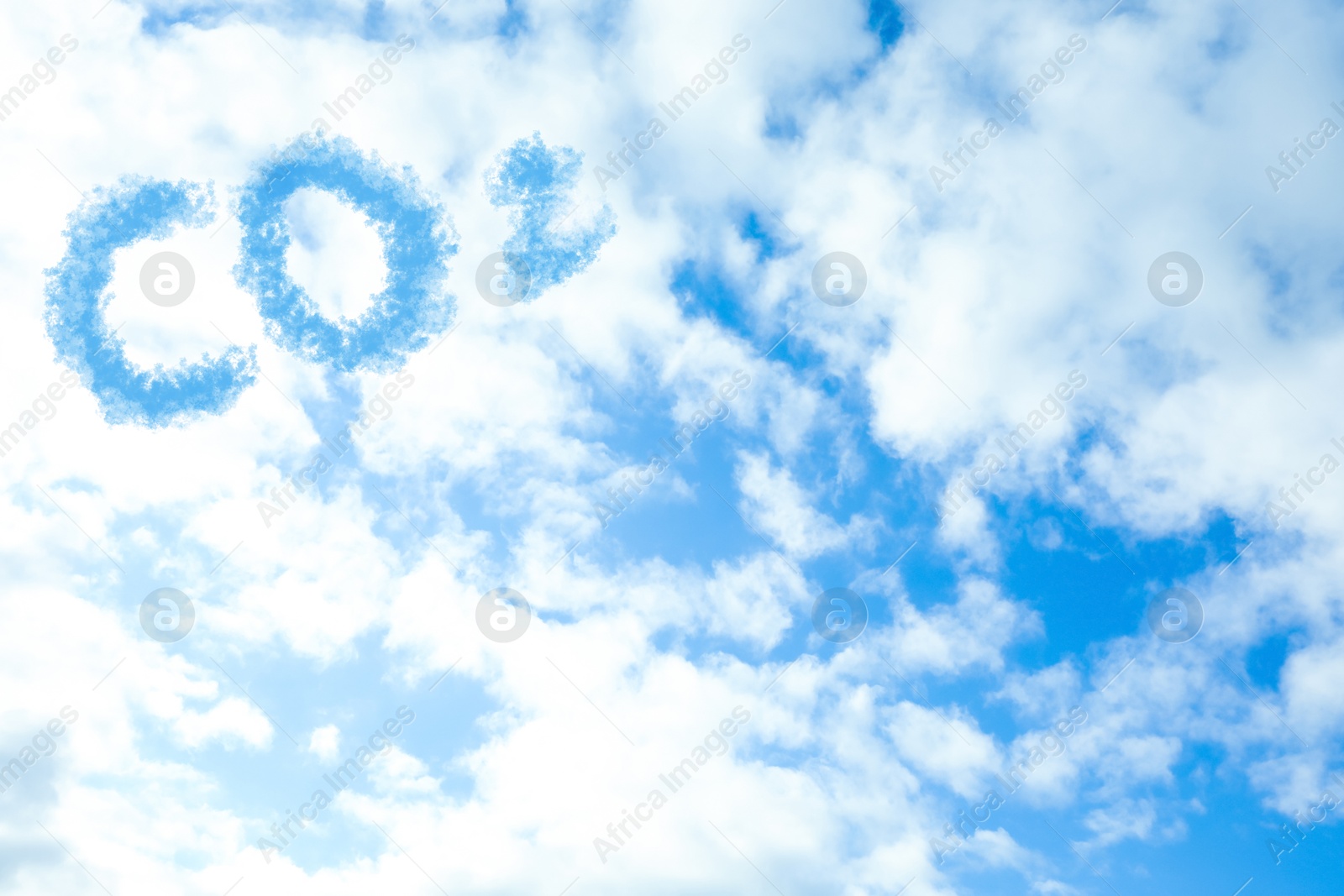 Image of Blue sky with CO2 chemical formula and clouds. Carbon dioxide emissions