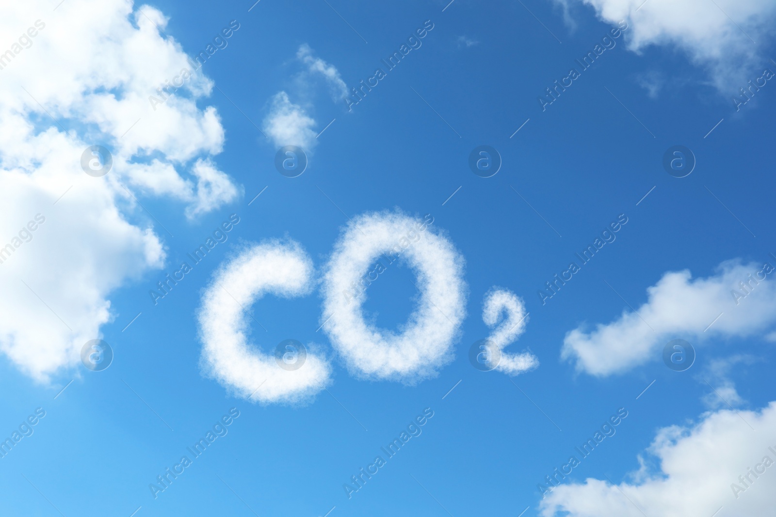 Image of Blue sky with CO2 chemical formula and clouds. Carbon dioxide emissions