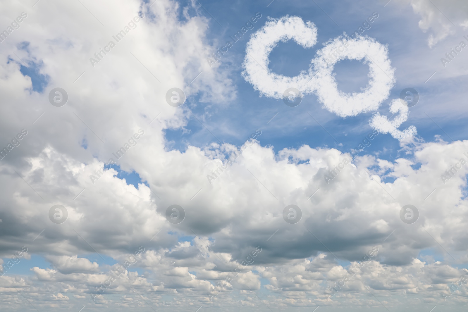 Image of Blue sky with CO2 chemical formula and clouds. Carbon dioxide emissions