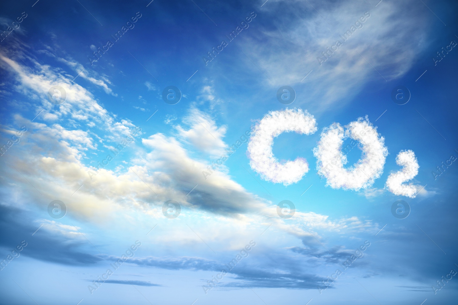 Image of Blue sky with CO2 chemical formula and clouds. Carbon dioxide emissions