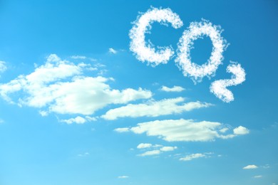 Image of Blue sky with CO2 chemical formula and clouds. Carbon dioxide emissions