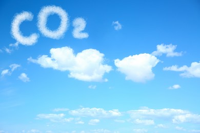 Image of Blue sky with CO2 chemical formula and clouds. Carbon dioxide emissions