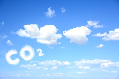 Blue sky with CO2 chemical formula and clouds. Carbon dioxide emissions