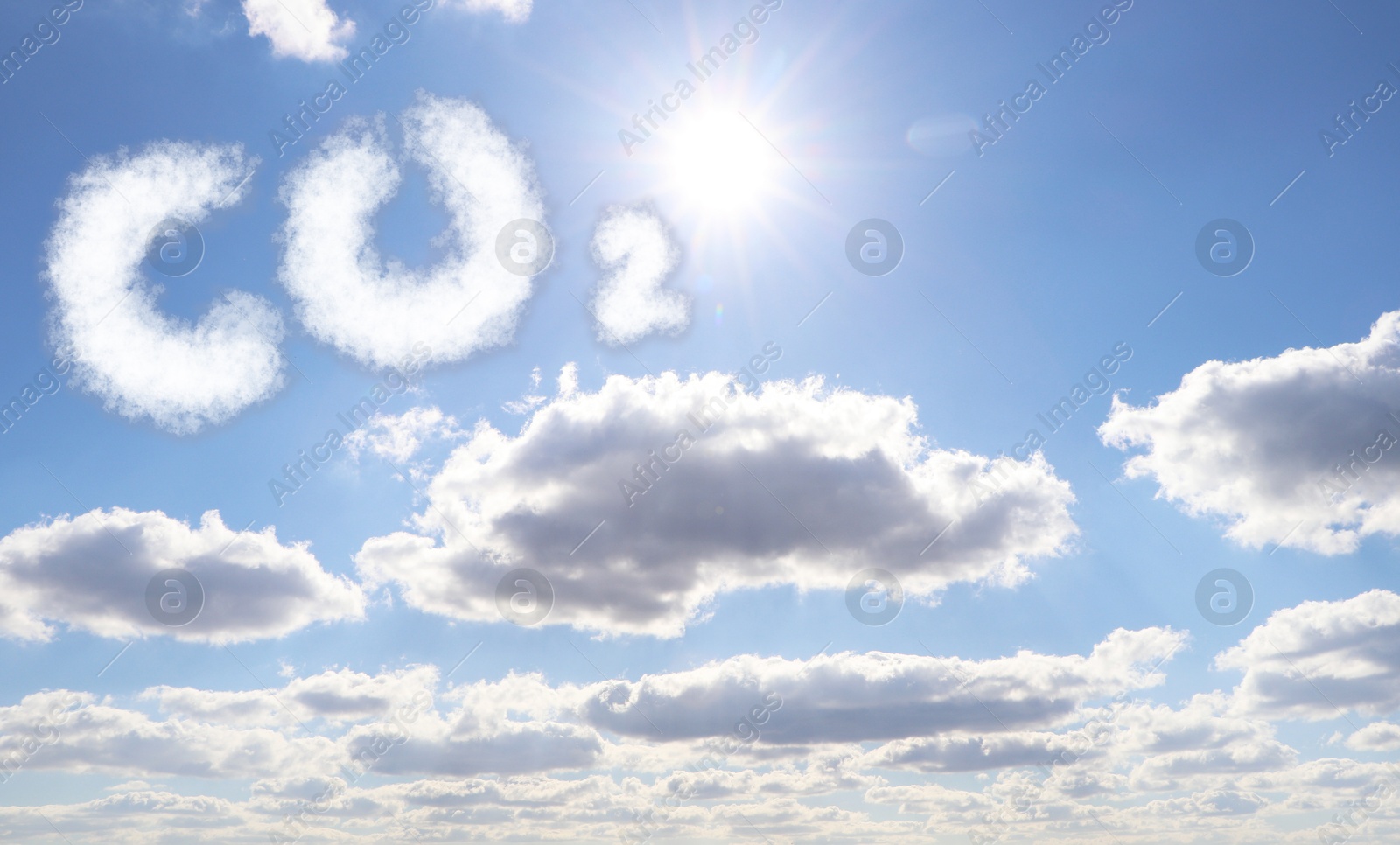 Image of Blue sky with CO2 chemical formula and clouds. Carbon dioxide emissions