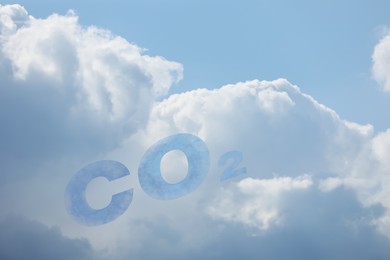 Blue sky with CO2 chemical formula and clouds. Carbon dioxide emissions