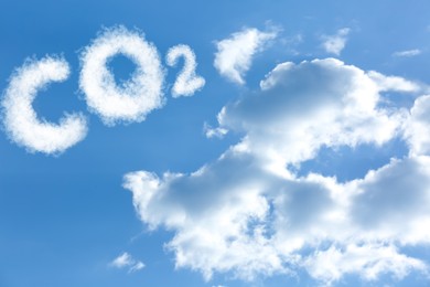 Image of Blue sky with CO2 chemical formula and clouds. Carbon dioxide emissions