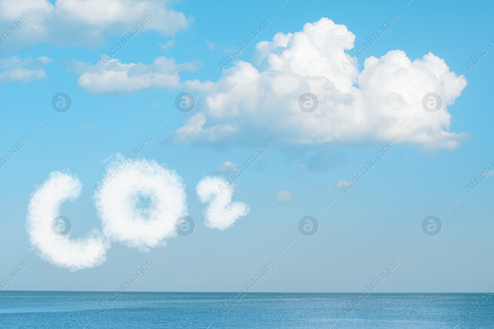 Image of Blue sky with CO2 chemical formula and clouds over sea. Carbon dioxide emissions