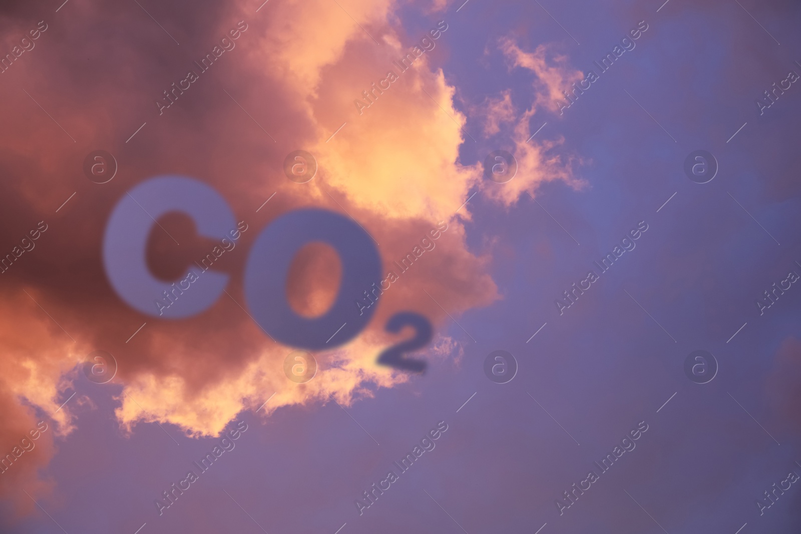 Image of Sunset sky with CO2 chemical formula and clouds. Carbon dioxide emissions