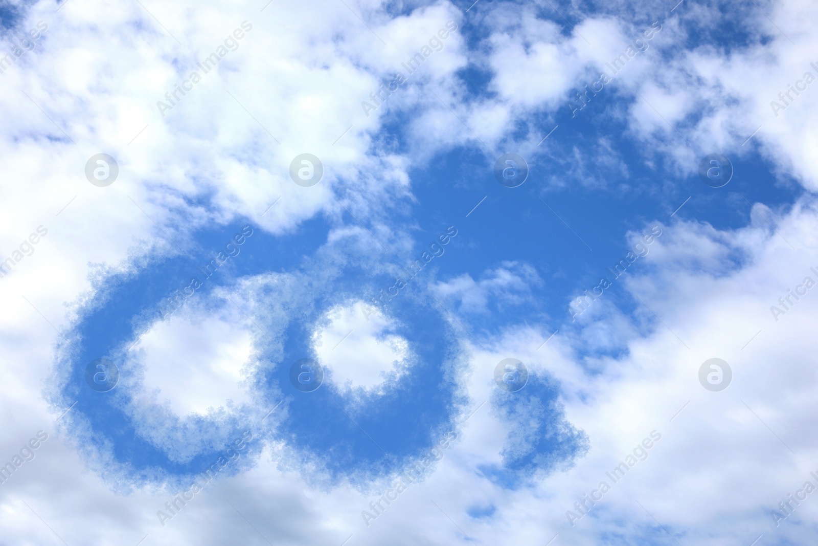 Image of Blue sky with CO2 chemical formula and clouds. Carbon dioxide emissions