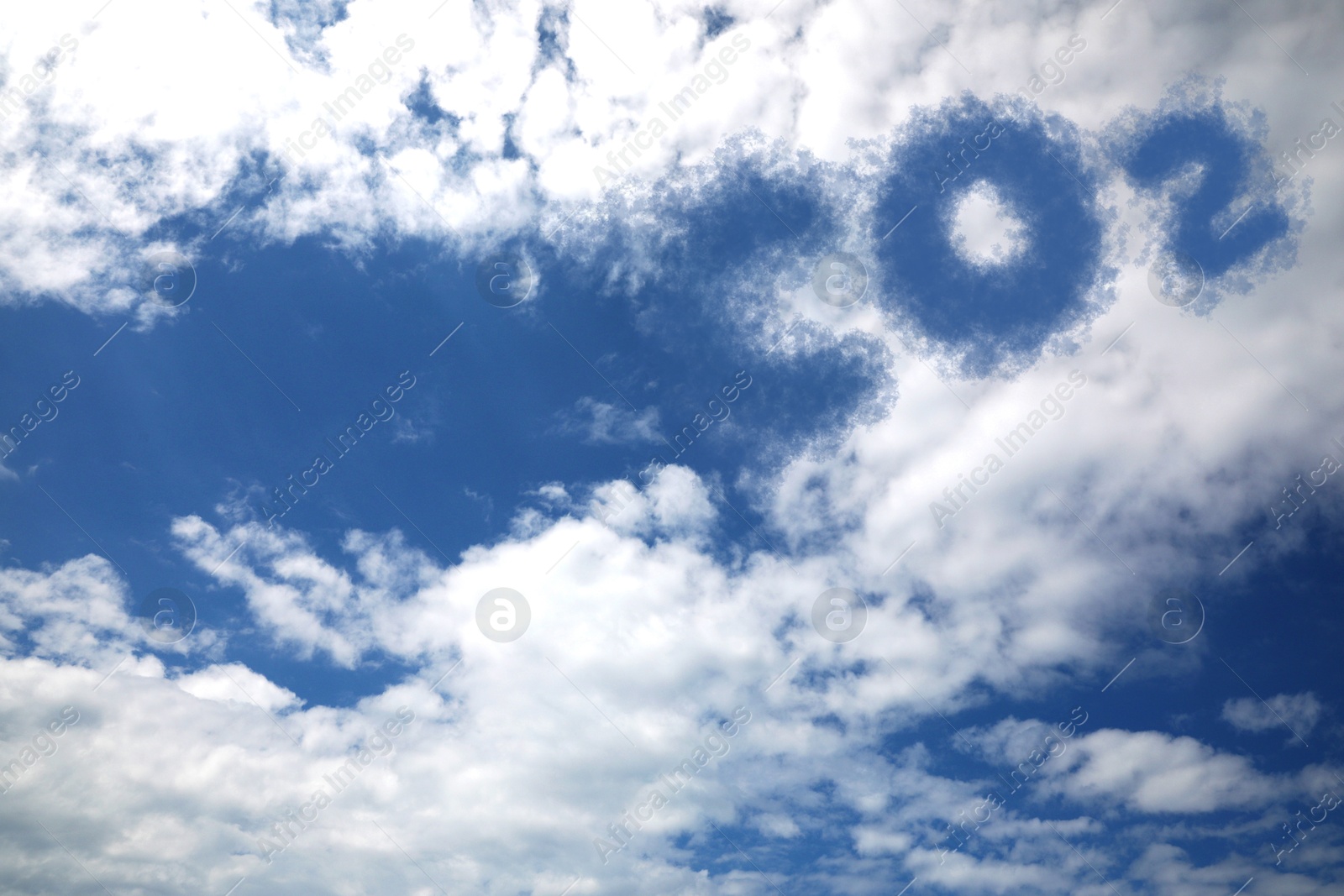 Image of Blue sky with CO2 chemical formula and clouds. Carbon dioxide emissions