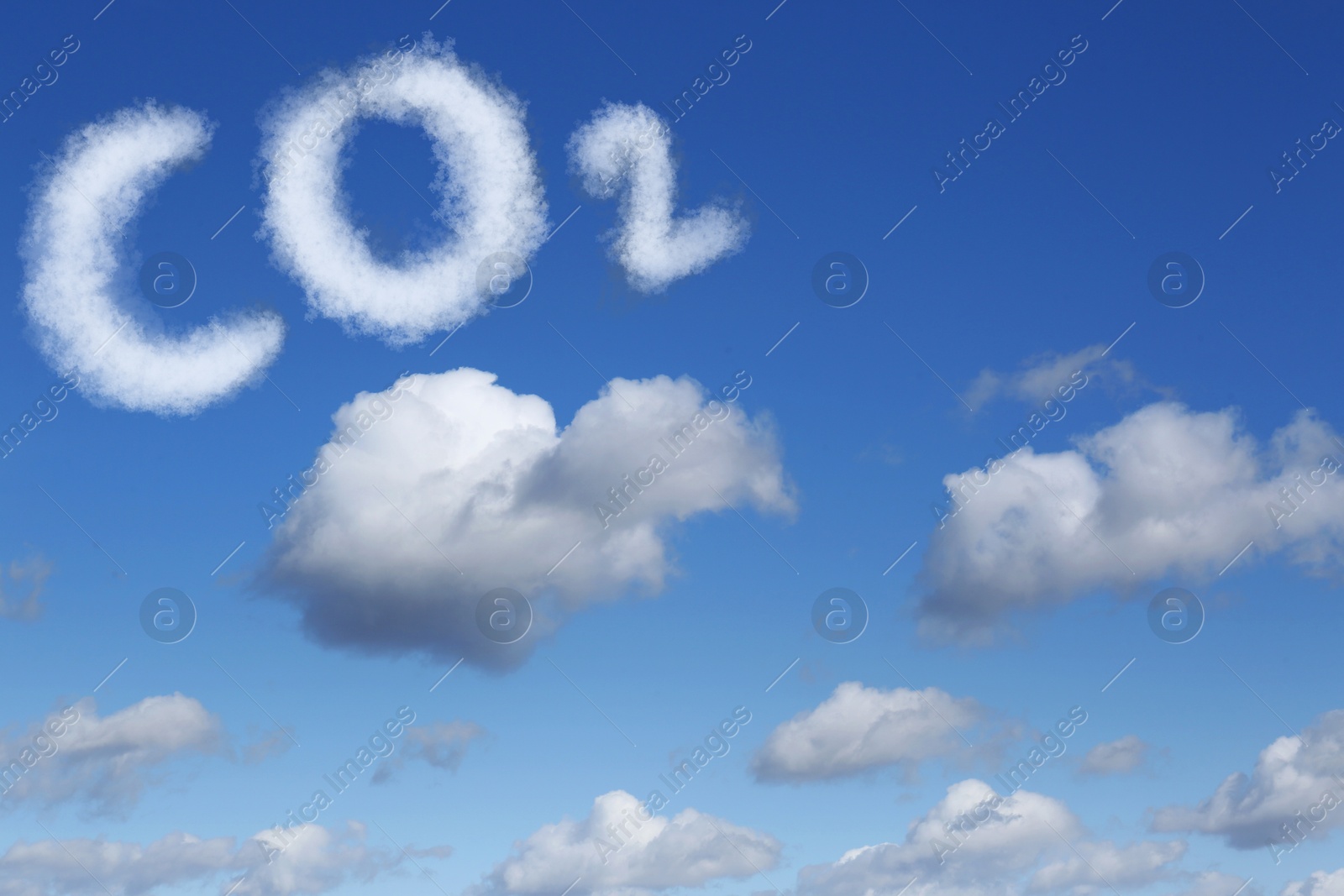 Image of Blue sky with CO2 chemical formula and clouds. Carbon dioxide emissions