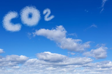 Image of Blue sky with CO2 chemical formula and clouds. Carbon dioxide emissions