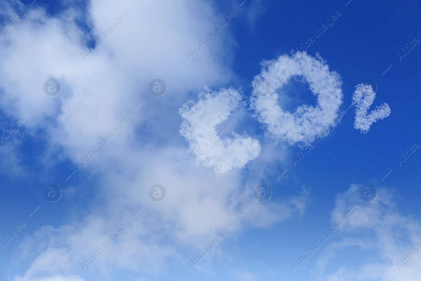 Image of Blue sky with CO2 chemical formula and clouds. Carbon dioxide emissions