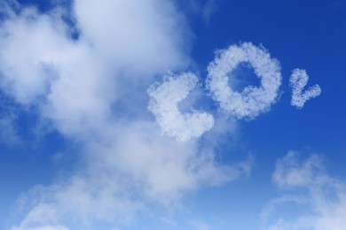 Blue sky with CO2 chemical formula and clouds. Carbon dioxide emissions