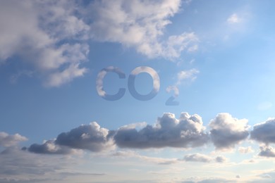 Blue sky with CO2 chemical formula and clouds. Carbon dioxide emissions