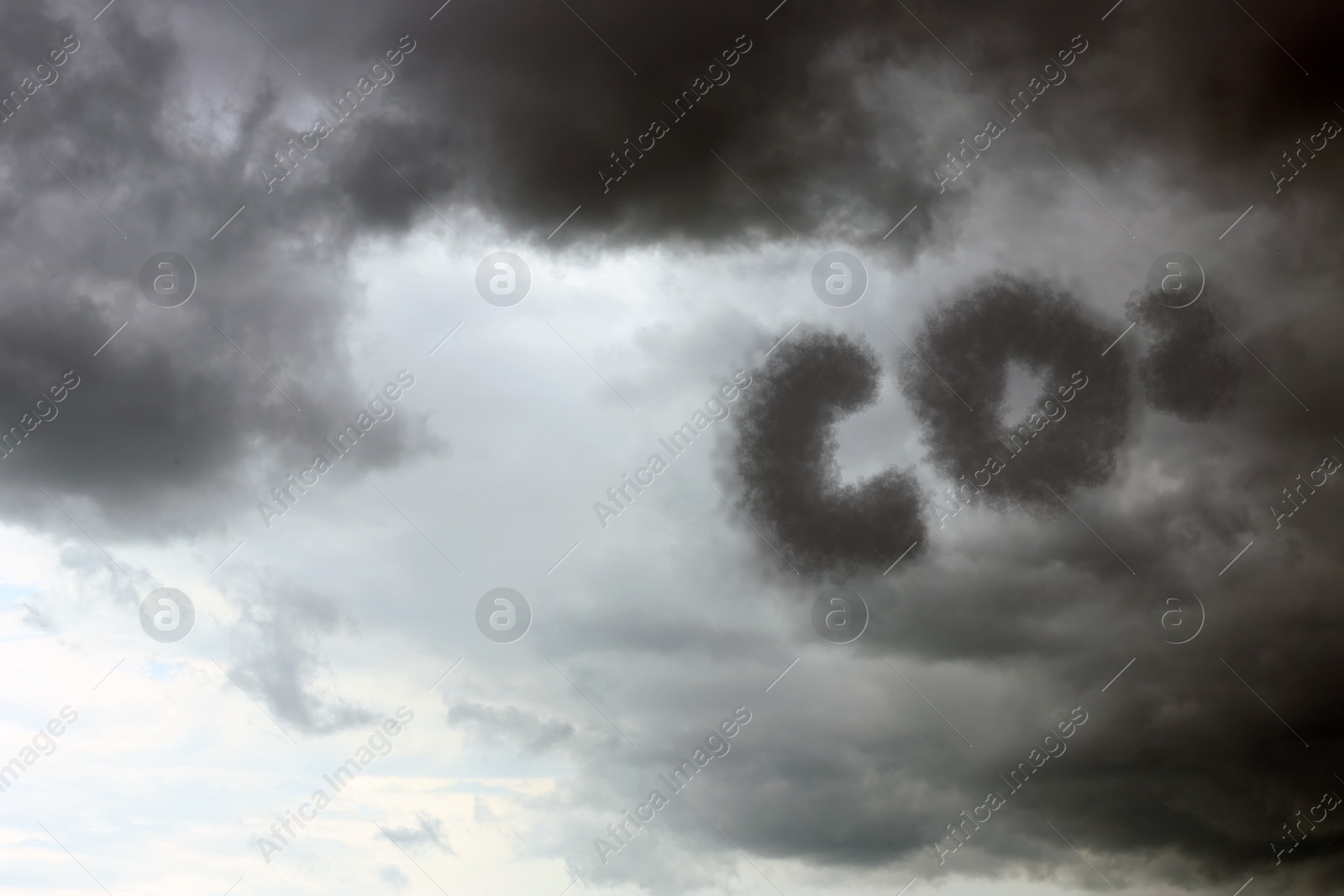 Image of Sky with CO2 chemical formula and clouds. Carbon dioxide emissions