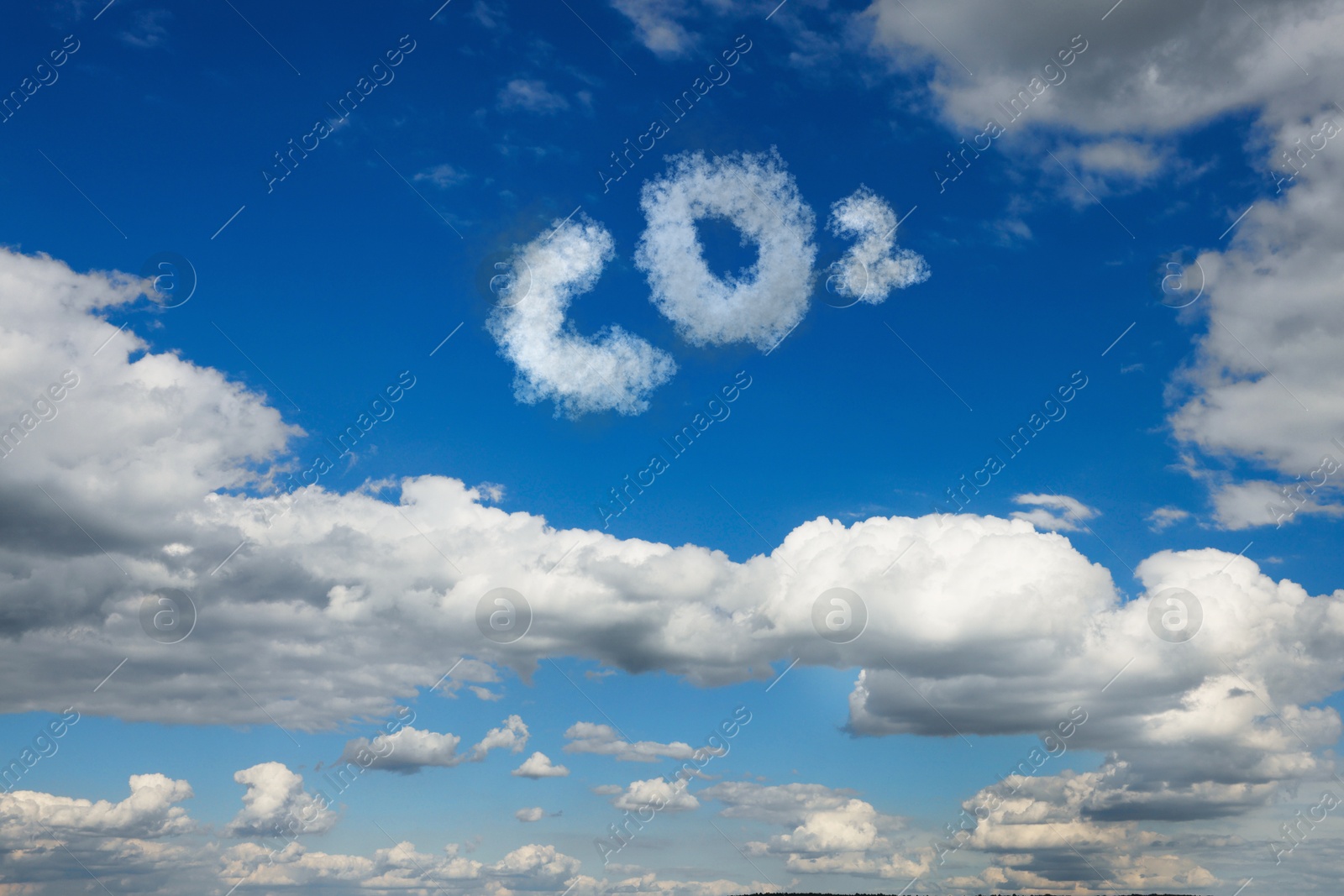 Image of Blue sky with CO2 chemical formula and clouds. Carbon dioxide emissions