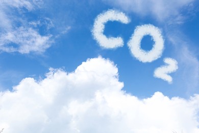 Image of Blue sky with CO2 chemical formula and clouds. Carbon dioxide emissions