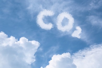 Image of Blue sky with CO2 chemical formula and clouds. Carbon dioxide emissions