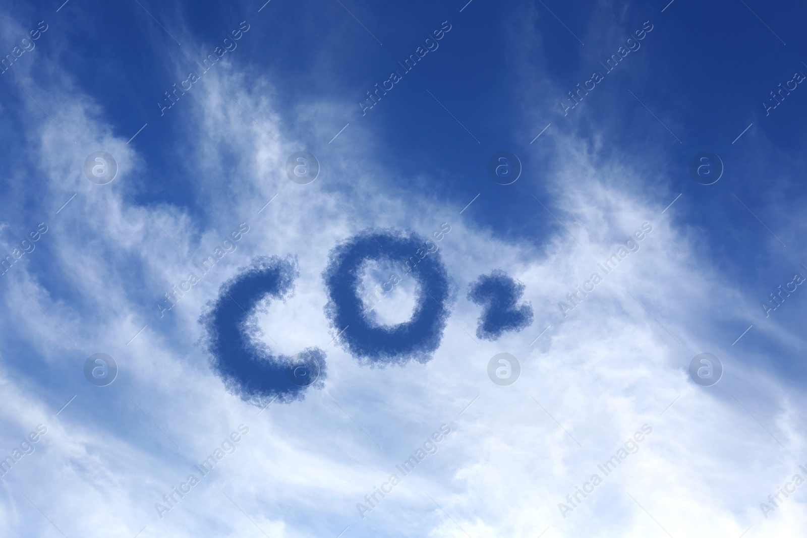 Image of Blue sky with CO2 chemical formula and clouds. Carbon dioxide emissions